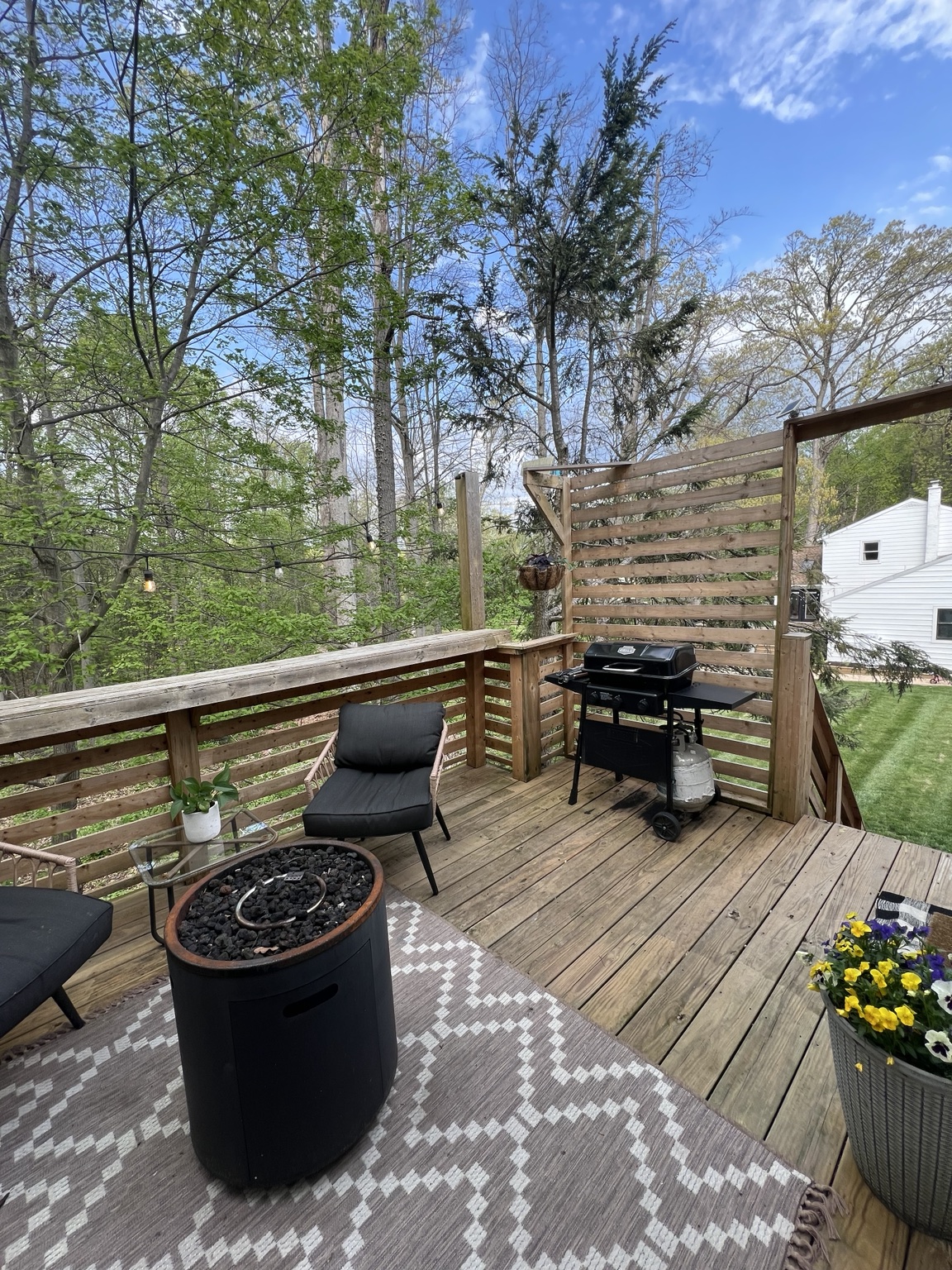 Deck with gas grill, privacy screen and views over the lawn
