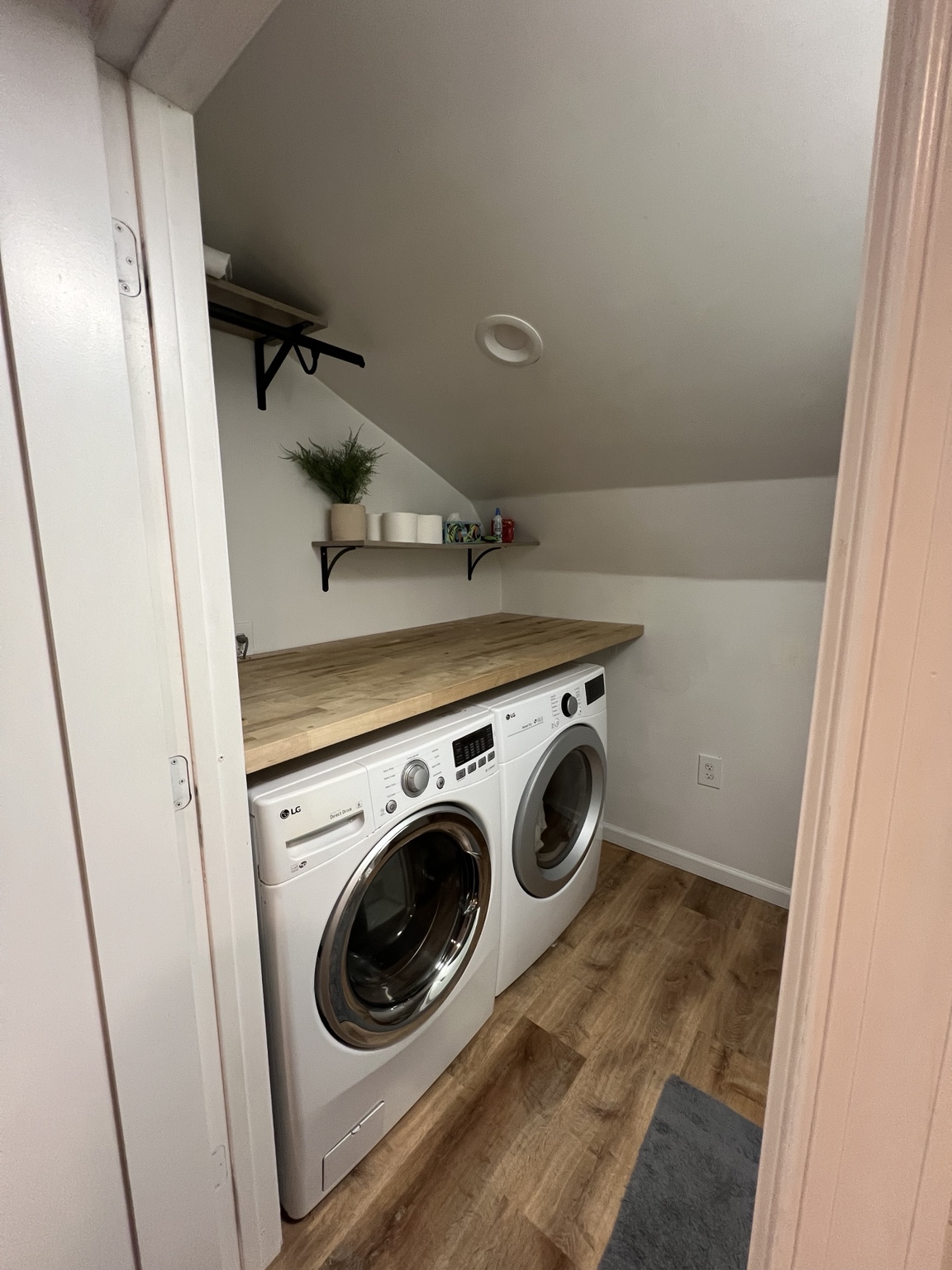Washer and dryer with folding counter and stocked shelf