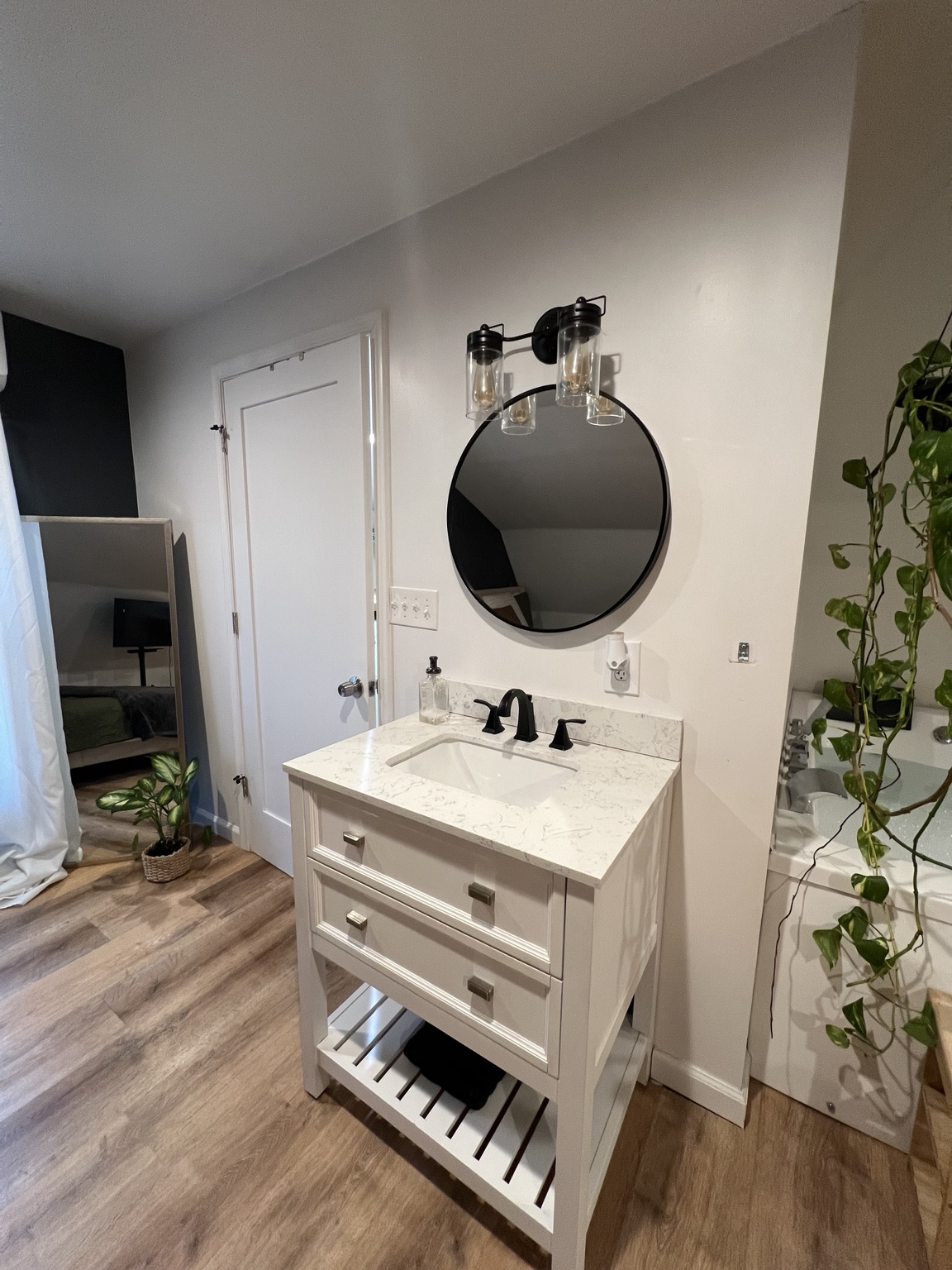 Marble-topped vanity beside the soaking tub
